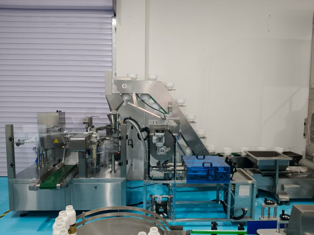 八工位給袋式包裝機和雙頭伺服灌裝機完美結(jié)合